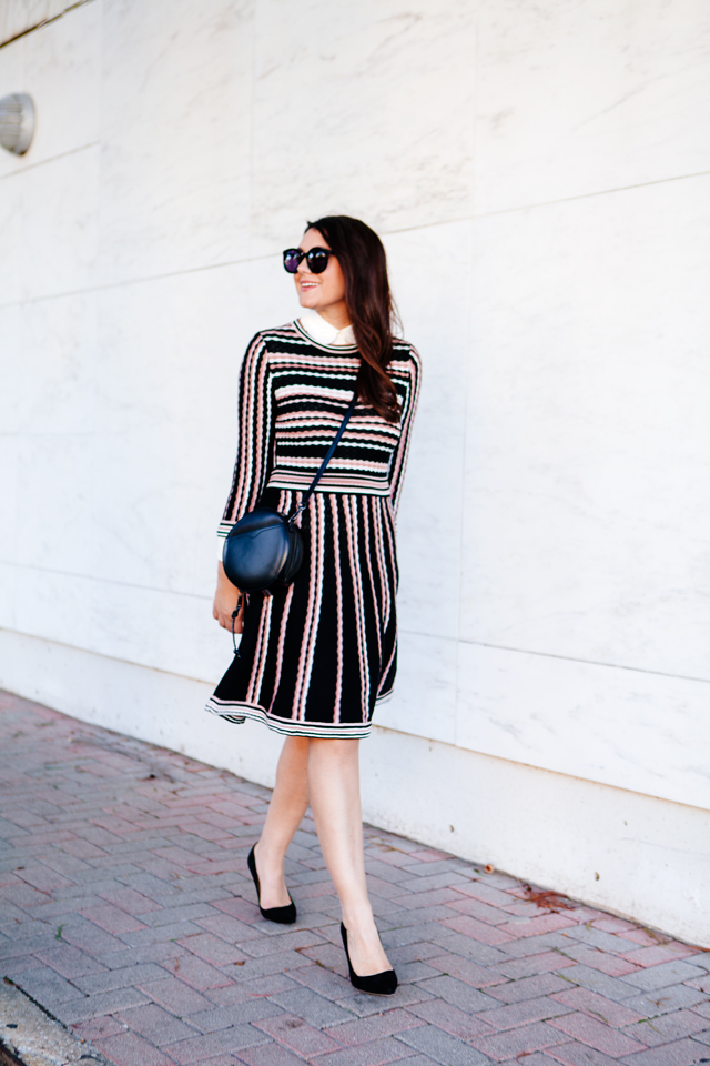 Kate Spade sweater dress with ruffle collar shirt and black cross body purse. 