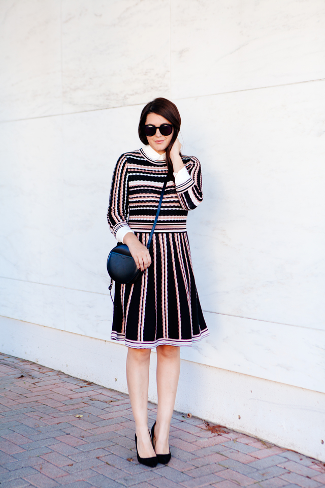 Kate Spade sweater dress with ruffle collar shirt and black cross body purse. 