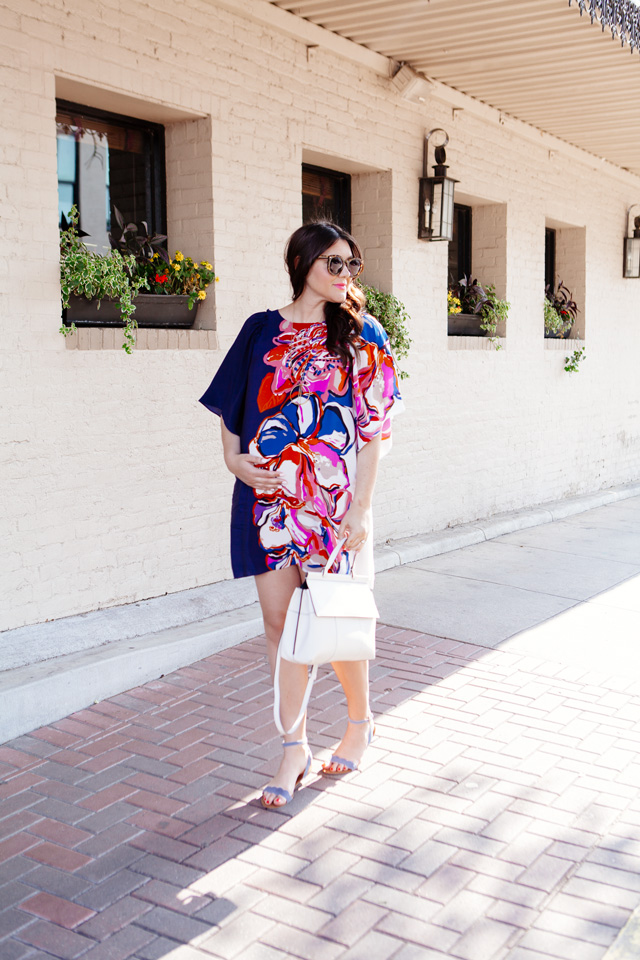 Silk floral dress with white handbag